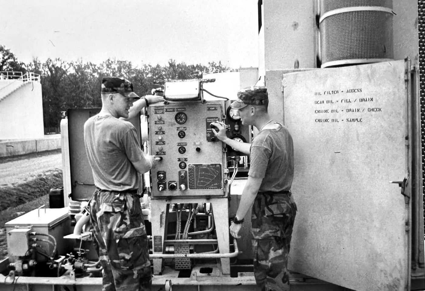Robbie Hardingham working a fuel pump control panel as a U.S. Army Petroleum Supply Specialist