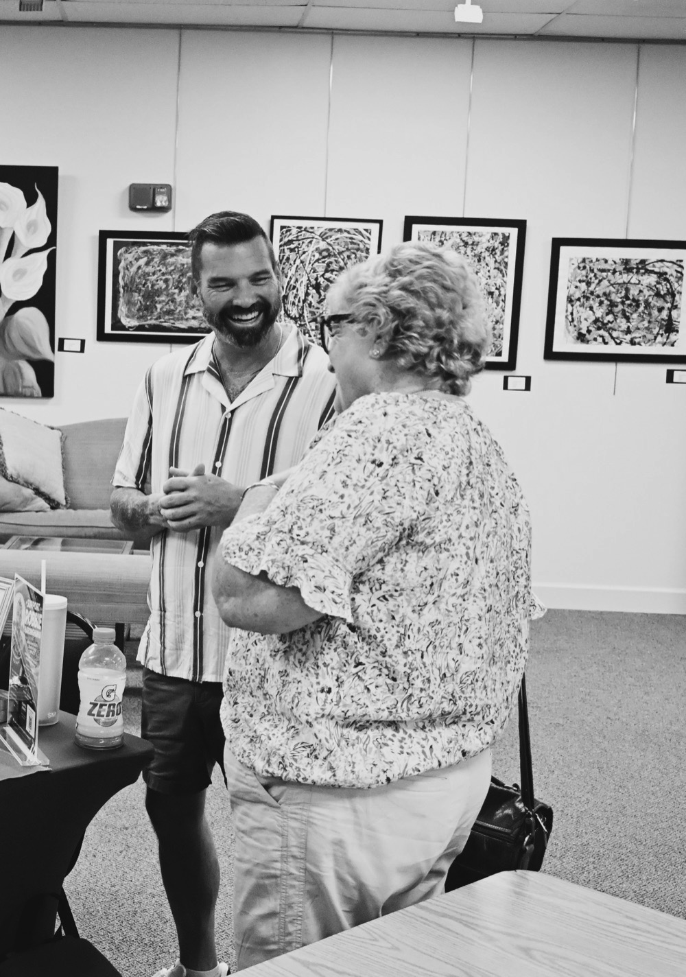 Robbie Hardingham talking with a resident at a community event in Vero Beach